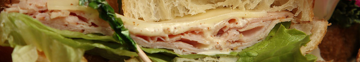 Eating Sandwich Cafe at Panera Bread restaurant in Chandler, AZ.